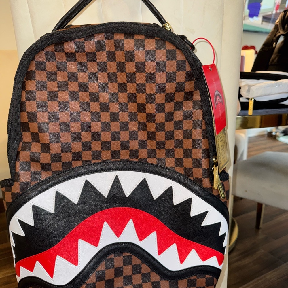 Sprayground Checkered Backpack with Red Shark Design